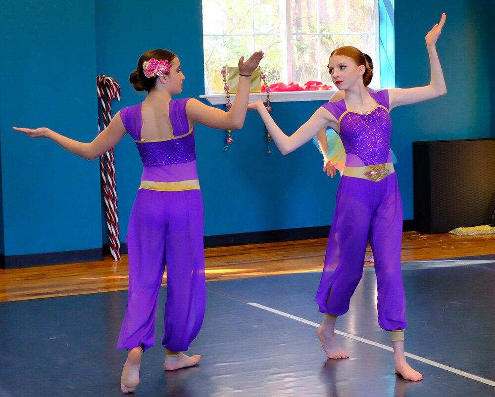 The dancers in purple, Devyn Moscatello (l.)  and Natalie Gorton, are performing an Arabian dance.